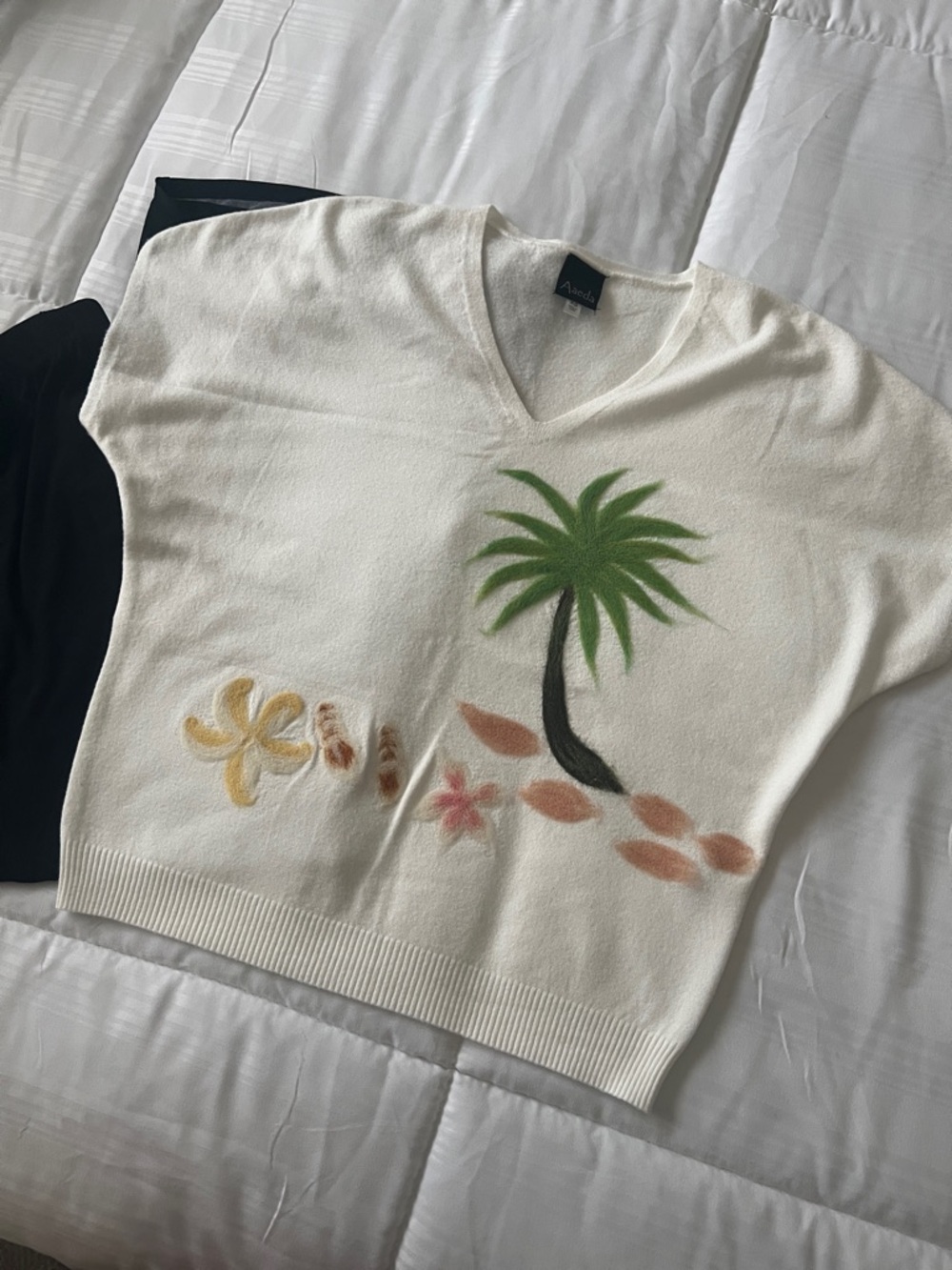 Women’s Cream V-Neck Sweater by Aaeda, with Palm Tree Motif perfect resort wear.
